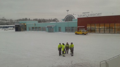 The ground crew at bustling Ivalo airport watching us depart