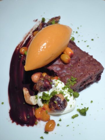 Chocolate brownie with sea-buckthorn berry sorbet and assorted garnishes